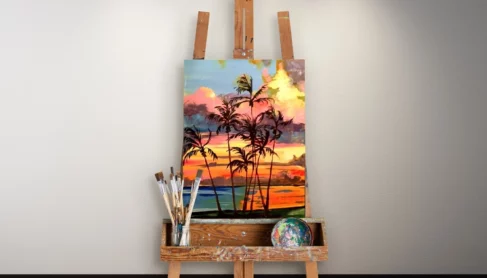 Island Palms painting by local artist Brenda Beal on canvas on an easel in front of a blank wall